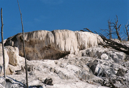 [The top lip of the formation looks like a bunch of thick icicles.]